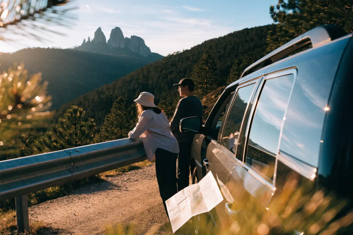 Travelers taking in a Black Hills overlook from their car