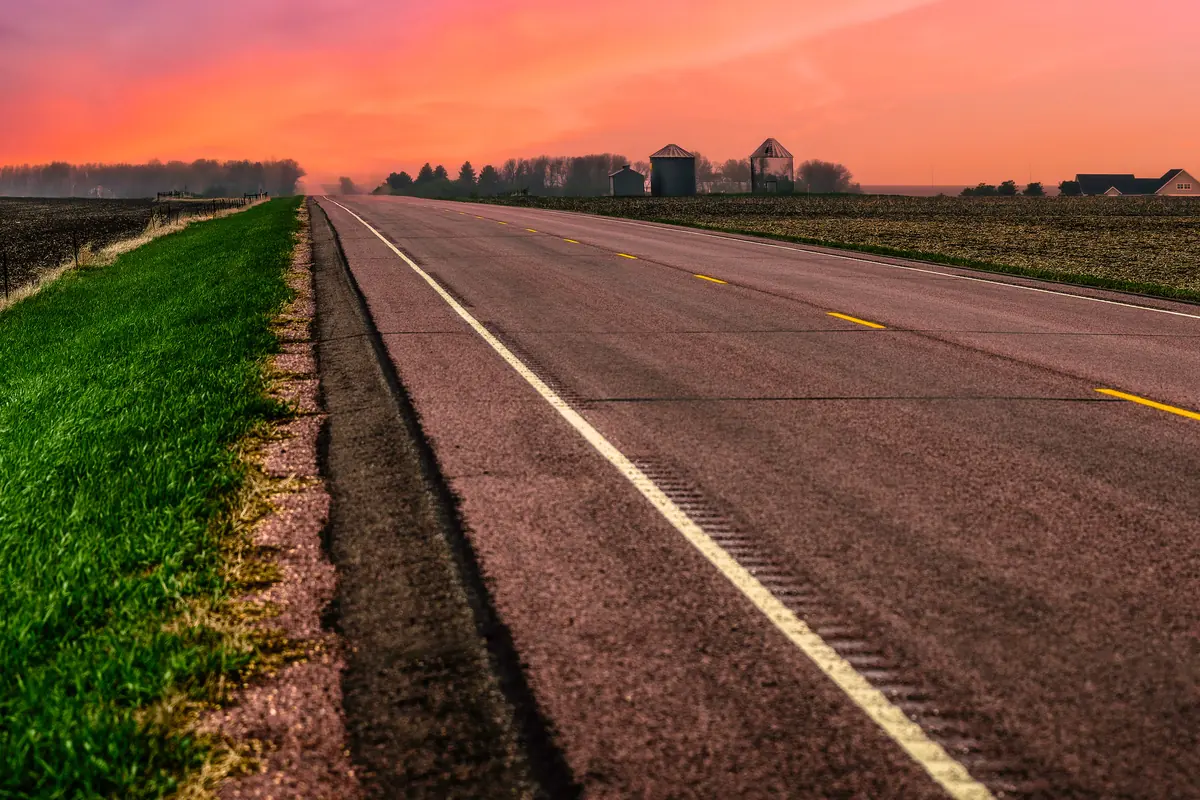 A rural South Dakota highway at sunset